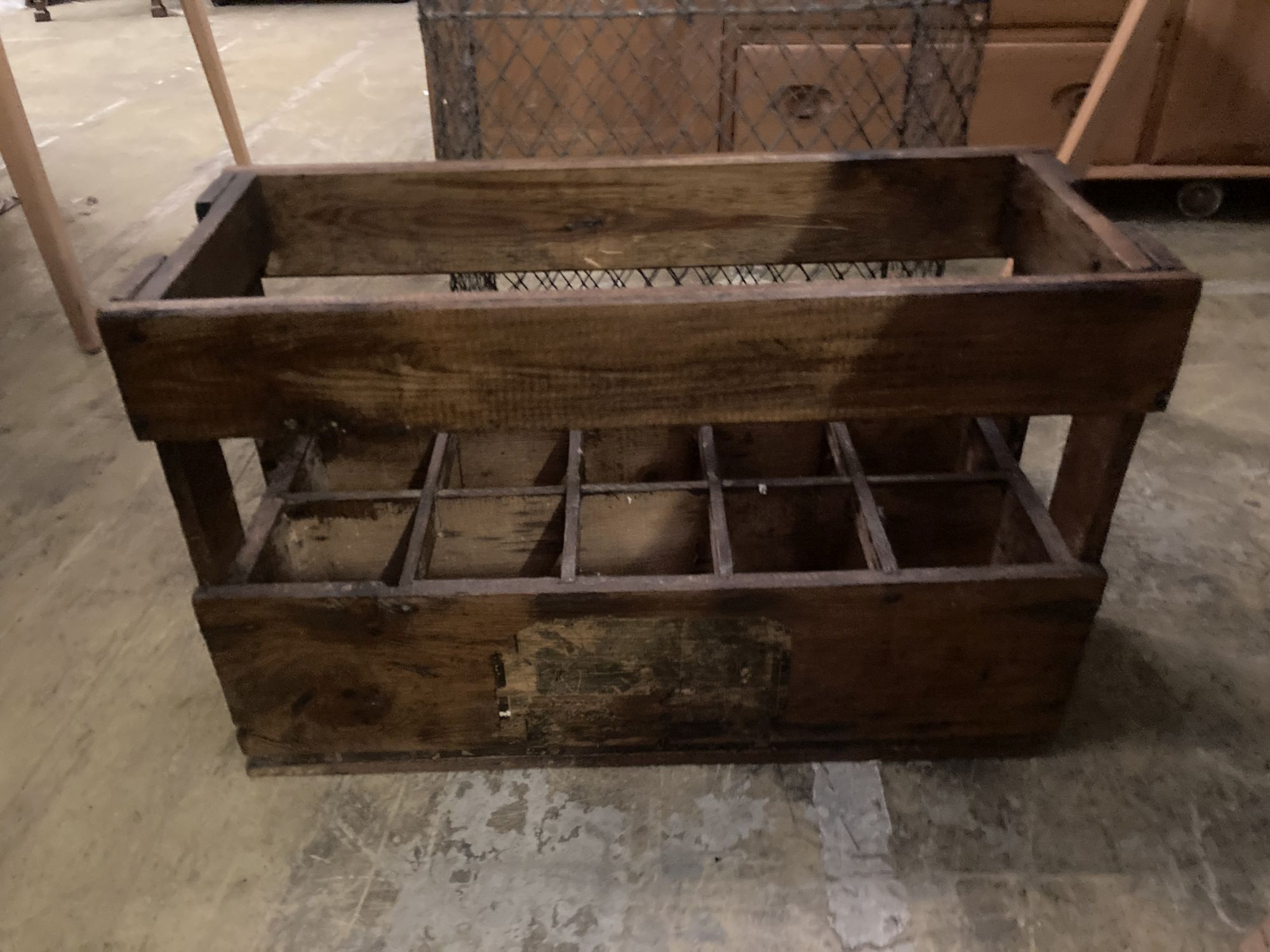 A vintage wood ten division bottle carrier, width 58cm depth 24cm height 37cm, together with a wirework rack